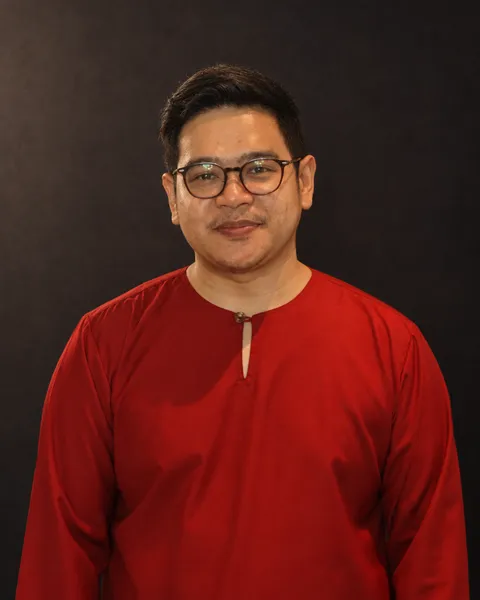 Darus Ishak in a red baju Melayu